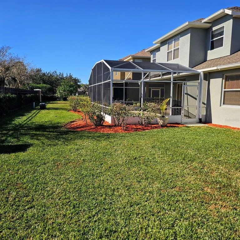 3463 Forest Ridge Lane Kissimmee, FL 34741 - Photo 5 of 58 a front view of a house with garden and porch