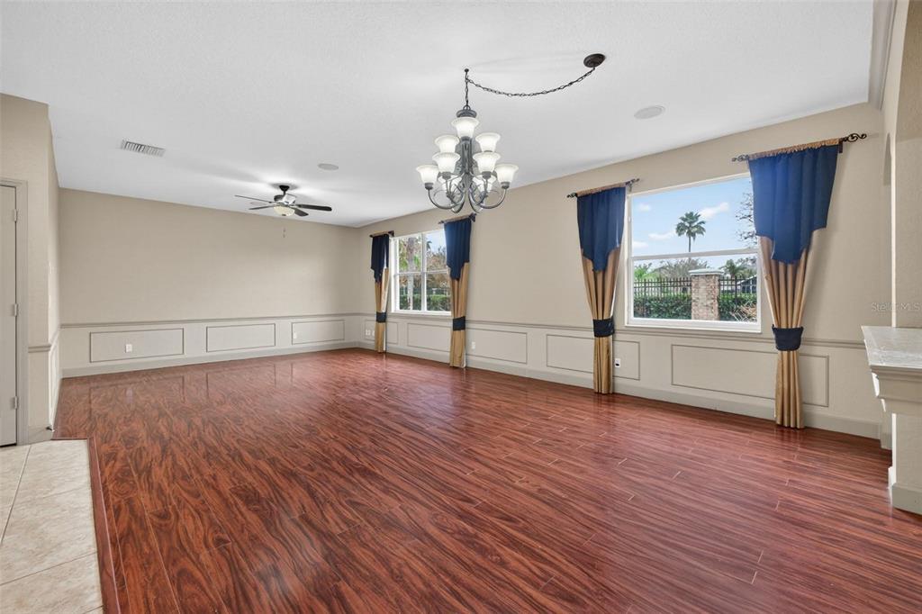 3463 Forest Ridge Lane Kissimmee, FL 34741 - Photo 10 of 58 a view of a room with wooden floor and large window