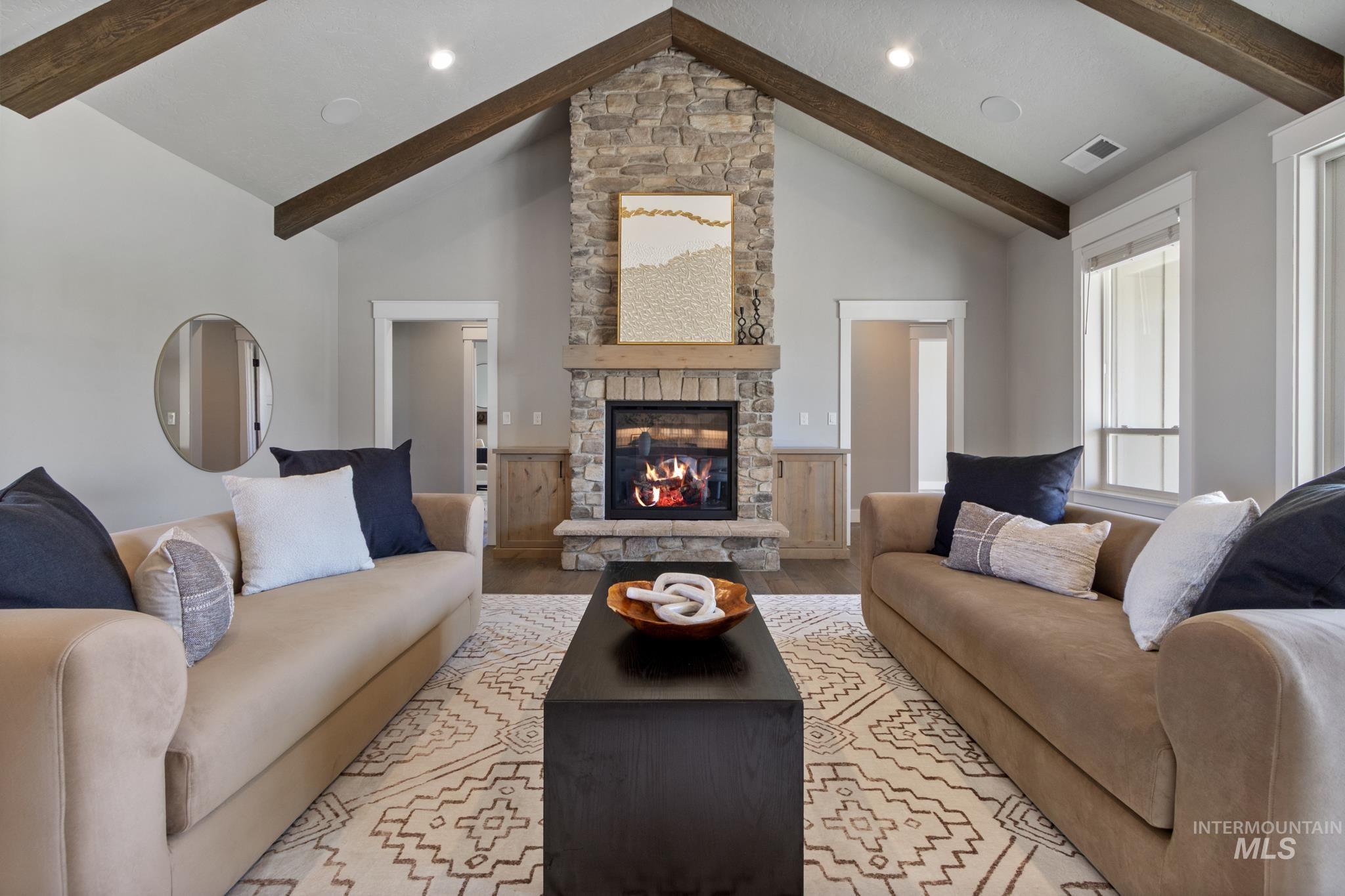 25427 Havard Oak Place Caldwell, ID 83607 - Photo 12 of 50 Living room with light wood finished floors and a fireplace