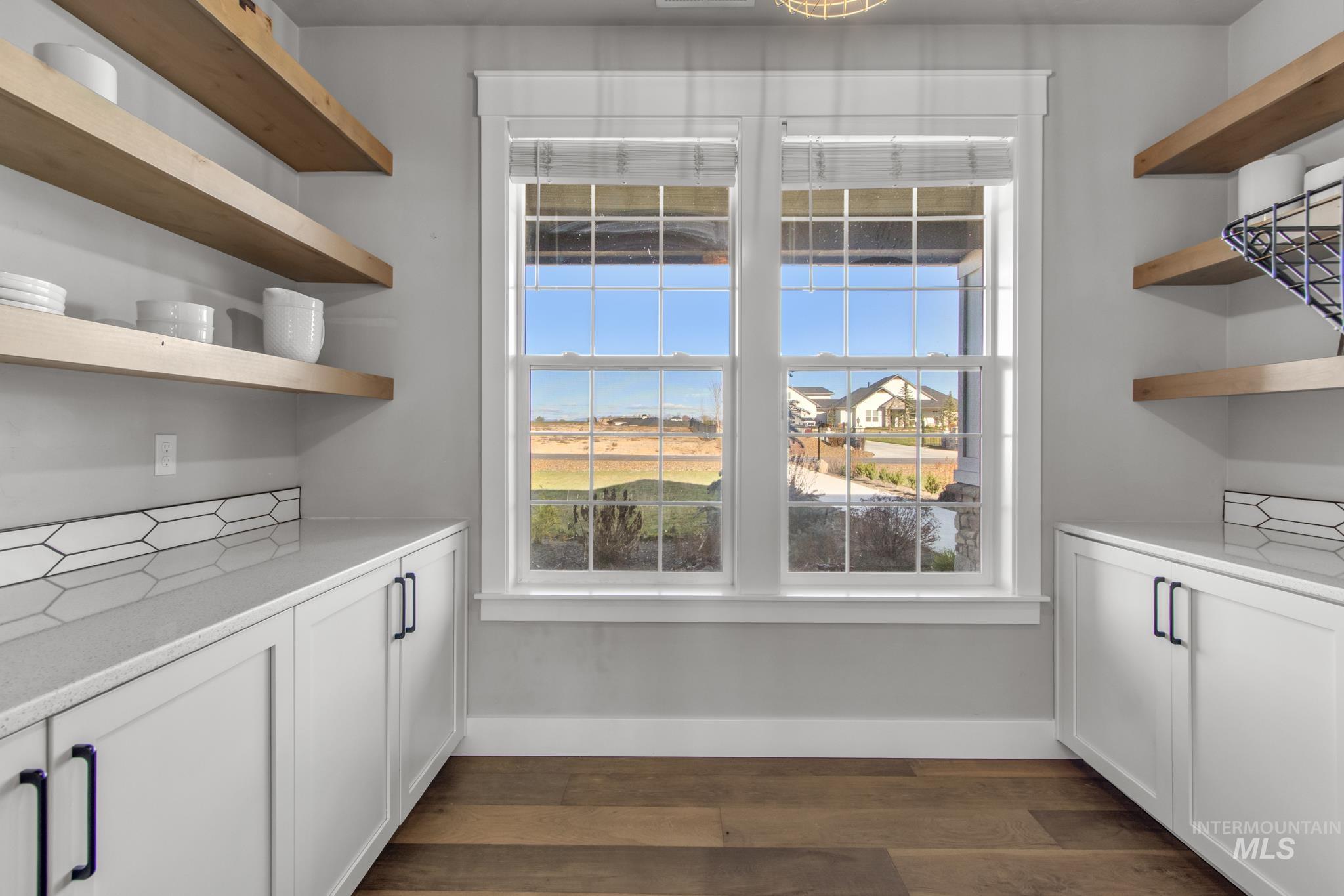 25427 Havard Oak Place Caldwell, ID 83607 - Photo 20 of 50 Interior space with dark wood-style floors and baseboards