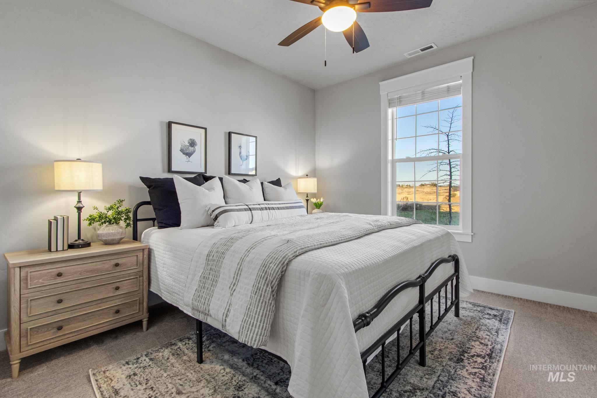 25427 Havard Oak Place Caldwell, ID 83607 - Photo 39 of 50 Bedroom with light colored carpet and ceiling fan