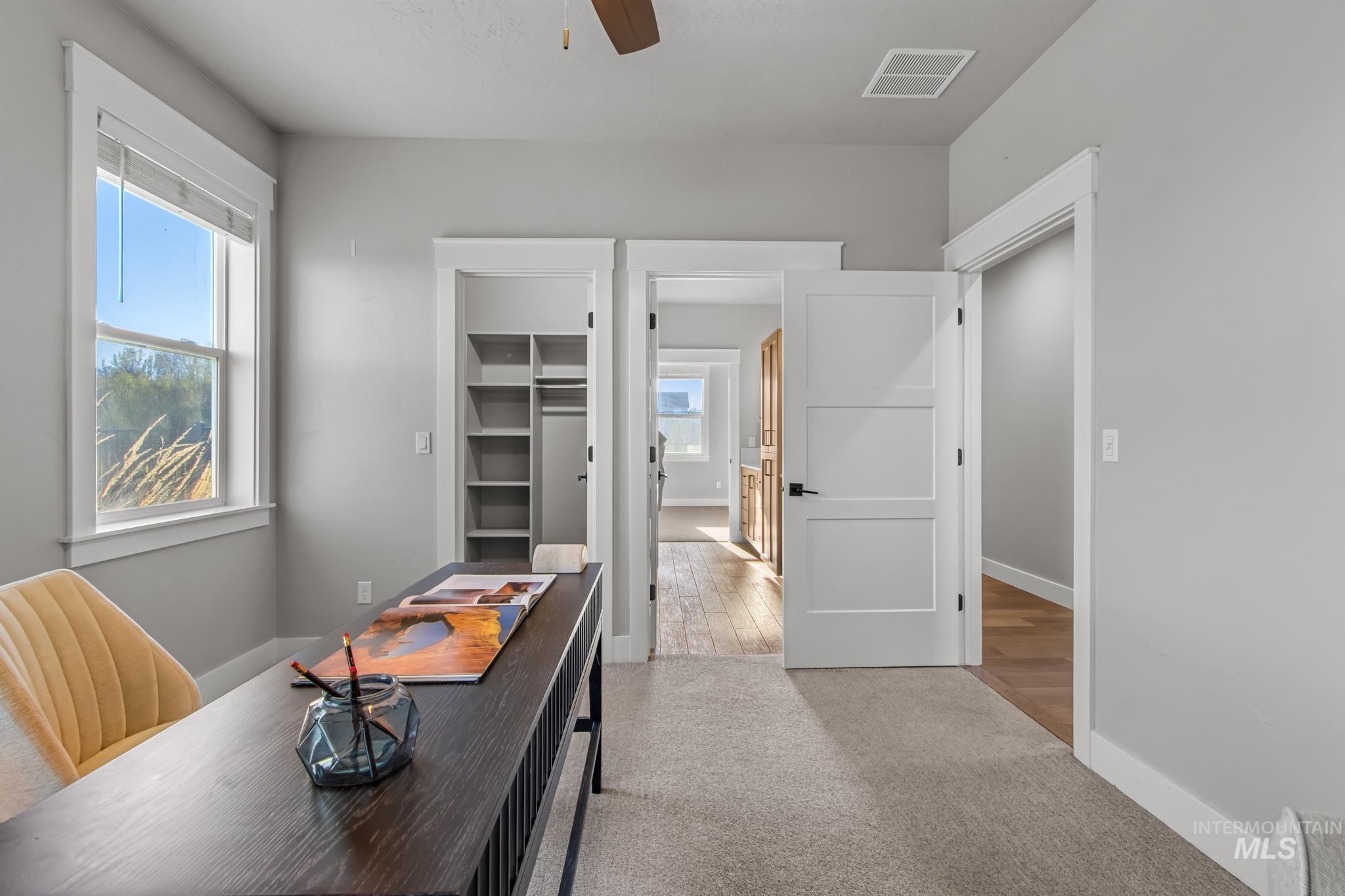 25427 Havard Oak Place Caldwell, ID 83607 - Photo 41 of 50 Home office with light colored carpet and a ceiling fan