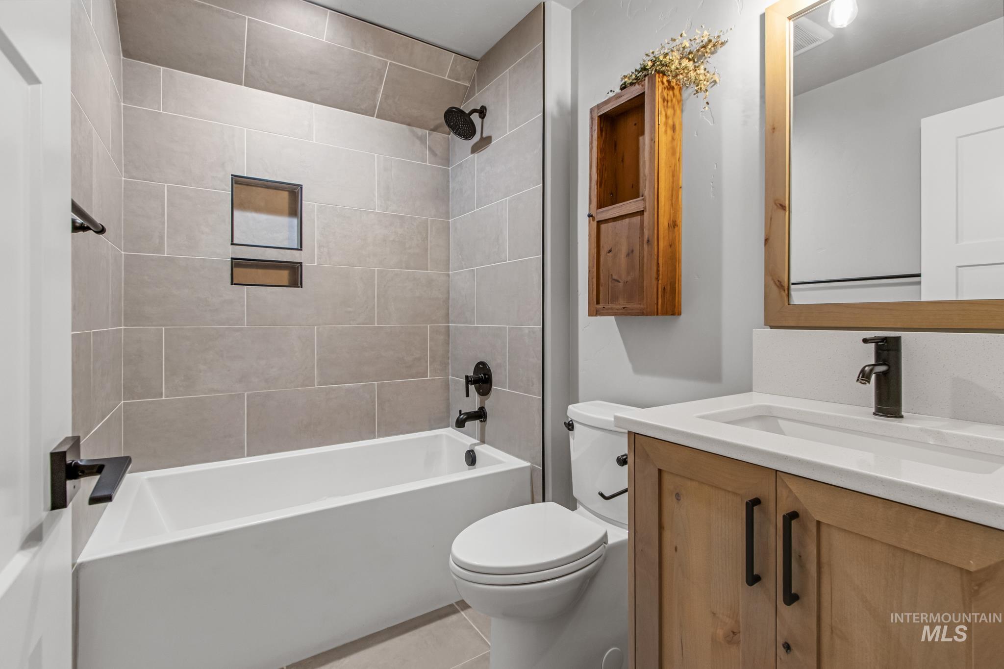 25427 Havard Oak Place Caldwell, ID 83607 - Photo 42 of 50 Full bathroom featuring vanity, bathtub / shower combination, and light tile patterned floors