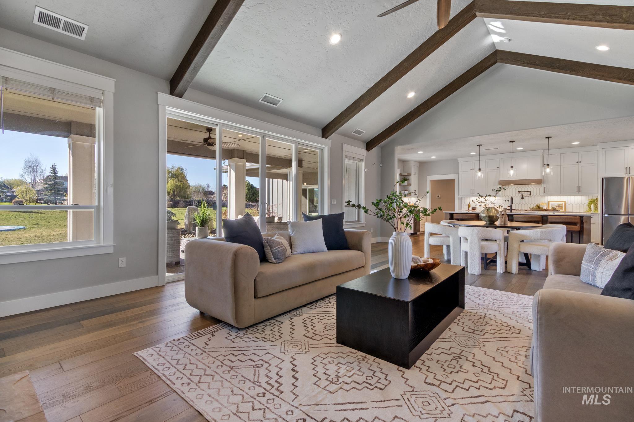 25427 Havard Oak Place Caldwell, ID 83607 - Photo 10 of 50 Living area featuring dark wood-style flooring, a ceiling fan, and recessed lighting
