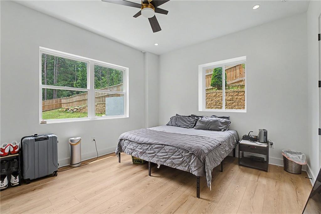 376 Hunnicut Road Southeast Mableton, GA 30126 - Photo 62 of 73 a bedroom with a bed and a table in it