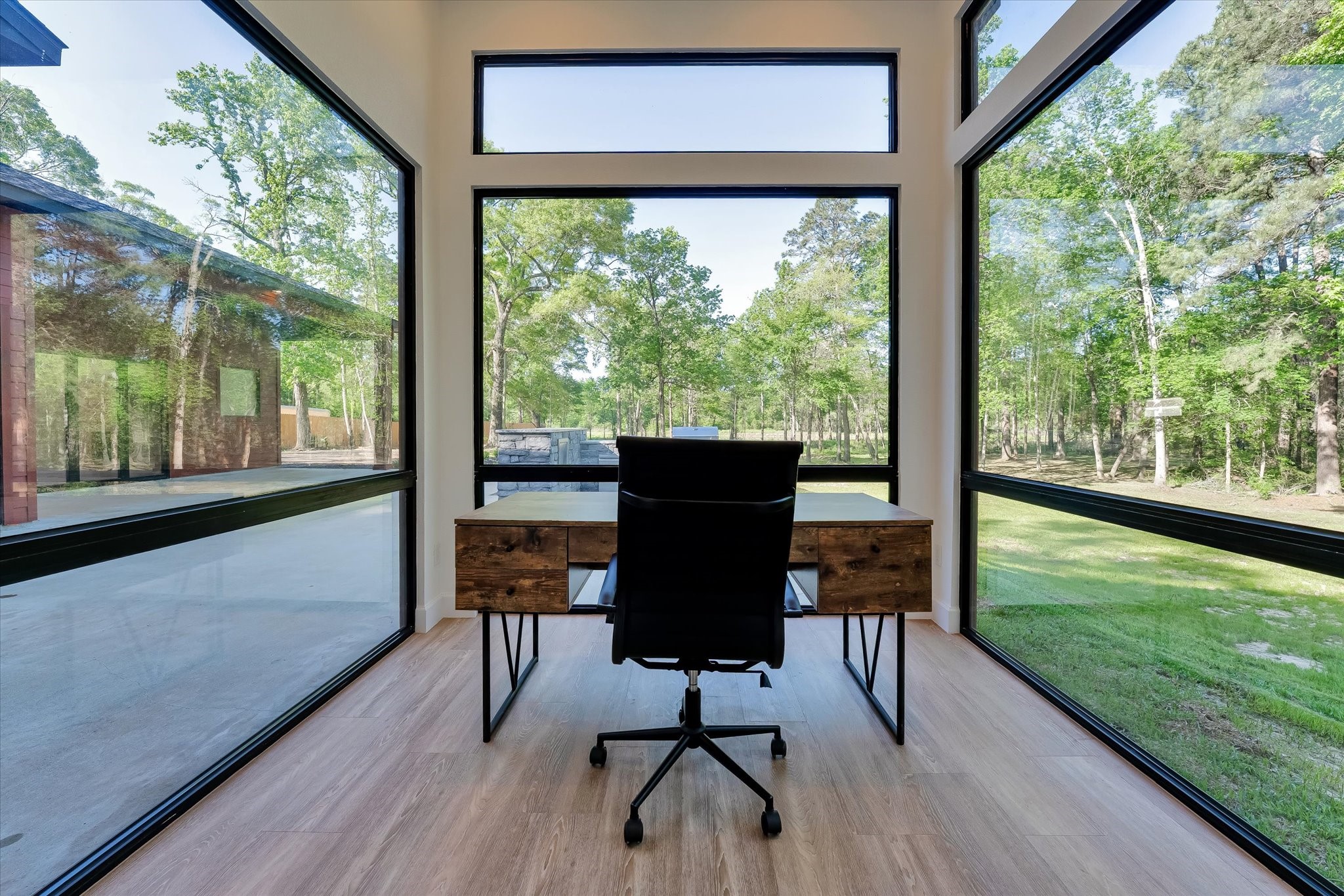 11571 Robin Lane Conroe, TX 77303 - Photo 20 of 49 a view of a floor to ceiling window with wooden floor