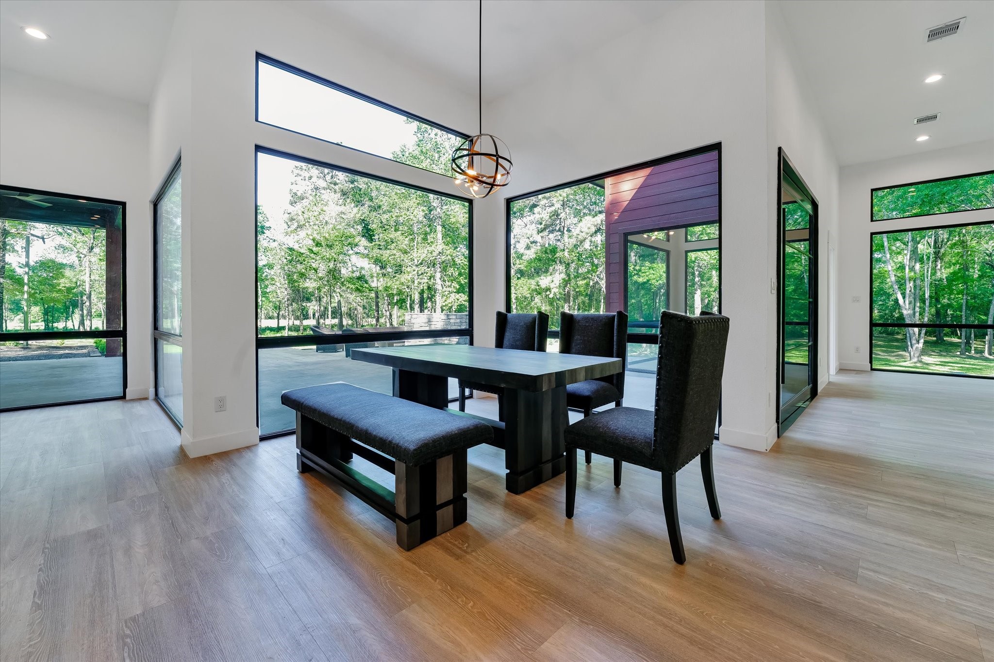 11571 Robin Lane Conroe, TX 77303 - Photo 21 of 49 a view of a dining room with furniture window and wooden floor