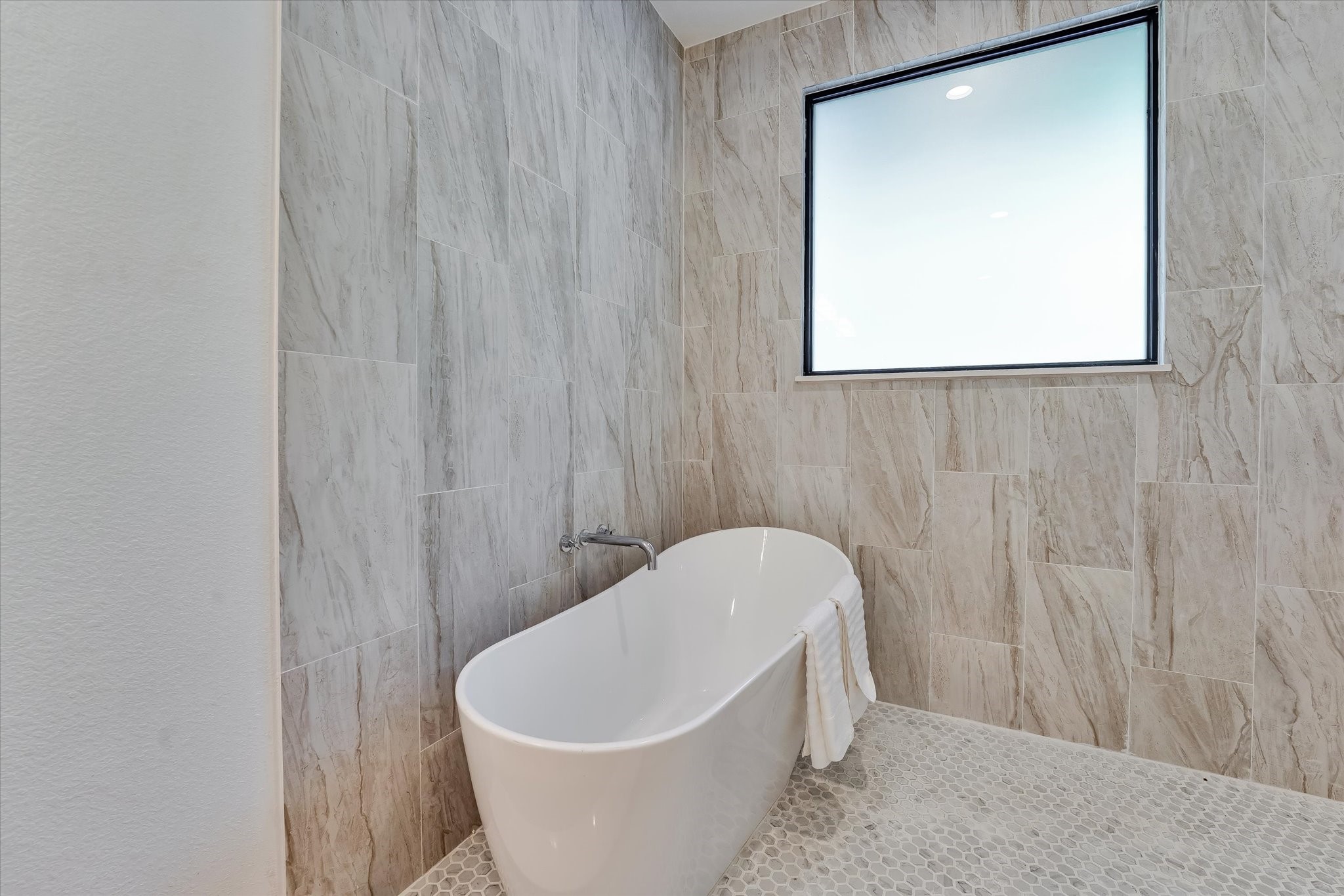 11571 Robin Lane Conroe, TX 77303 - Photo 31 of 49 a white bath tub sitting in a bathroom