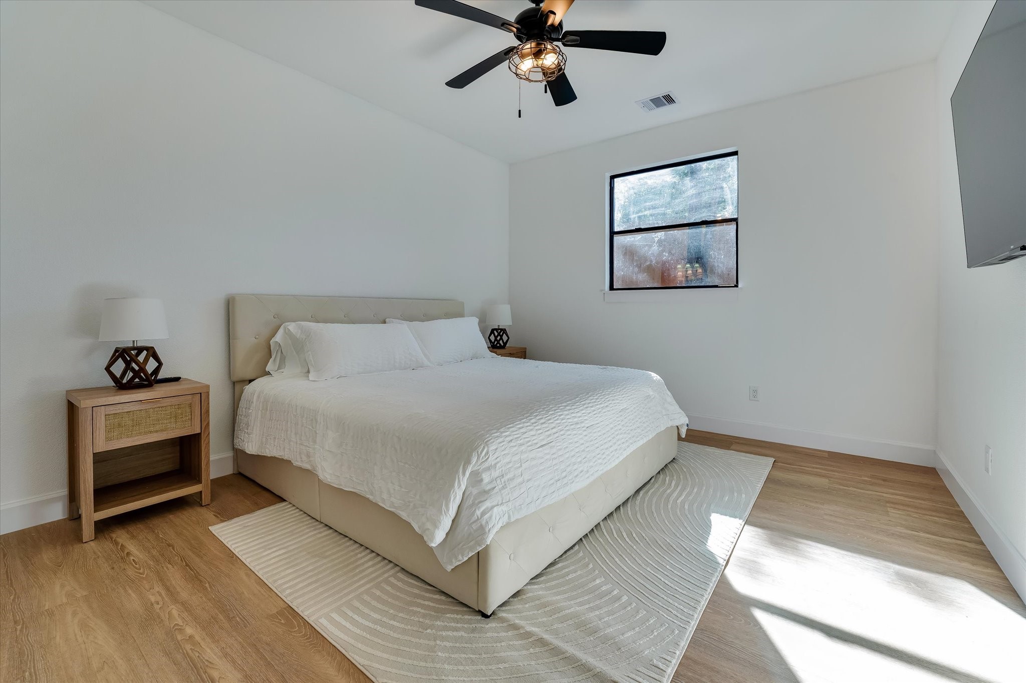 11571 Robin Lane Conroe, TX 77303 - Photo 39 of 49 a bedroom with a bed and cabinets