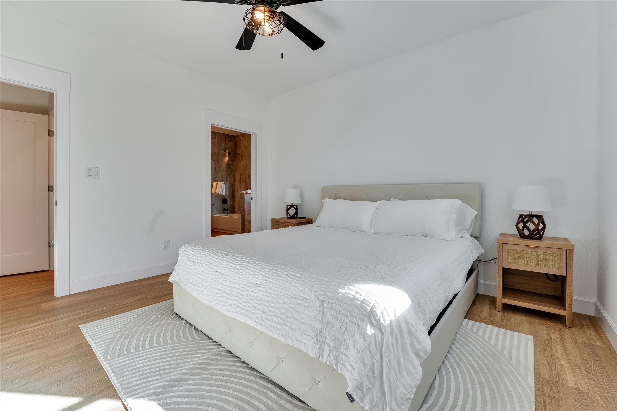 11571 Robin Lane Conroe, TX 77303 - Photo 40 of 49 a bedroom with a bed and wooden floor