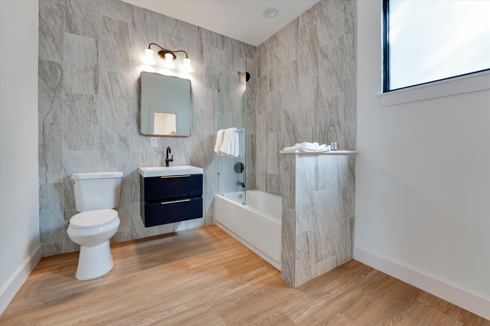 11571 Robin Lane Conroe, TX 77303 - Photo 41 of 49 a spacious bathroom with a bathtub a sink and a mirror
