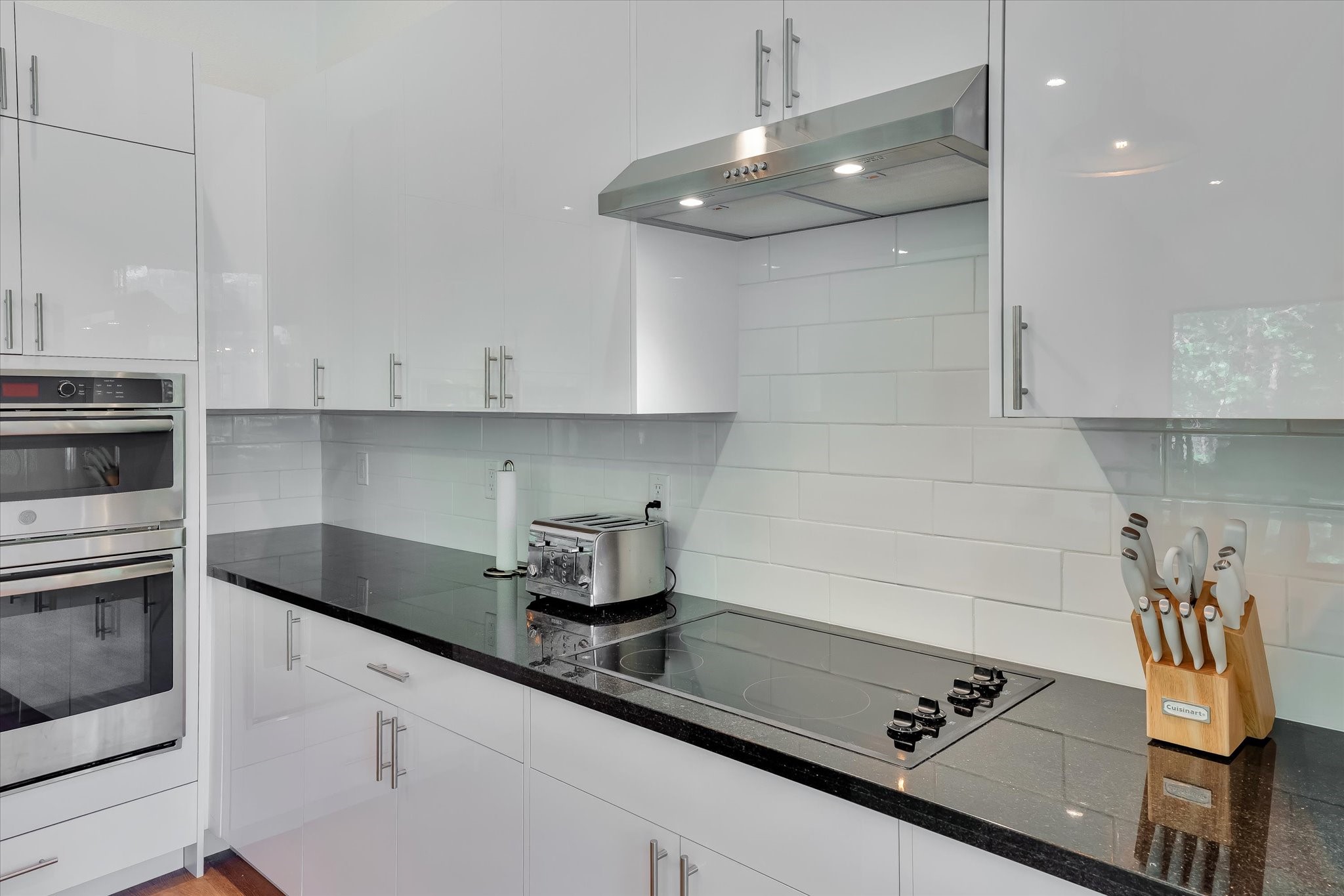 11571 Robin Lane Conroe, TX 77303 - Photo 8 of 49 a kitchen with stainless steel appliances a sink a stove and cabinets