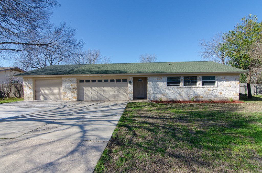 601 Seminole Road Leander, TX 78641 - Photo 1 of 1 2 car garage plus the roll up doors front and back of the additional 2 car garage.