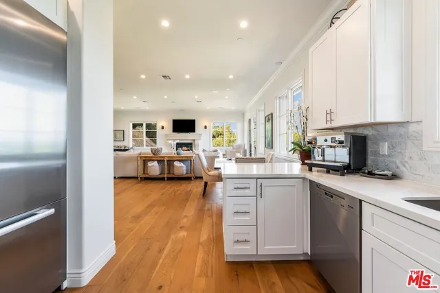 a living room with fireplace furniture and a flat screen tv