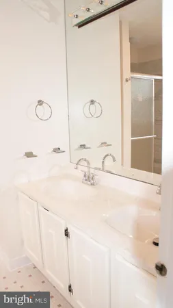a bathroom with a shower and a sink