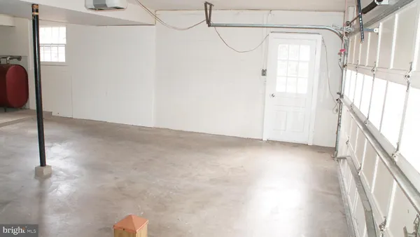 a view of a room with wooden floor and windows