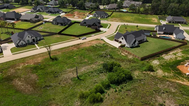an aerial view of a house with yard swimming pool and outdoor seating