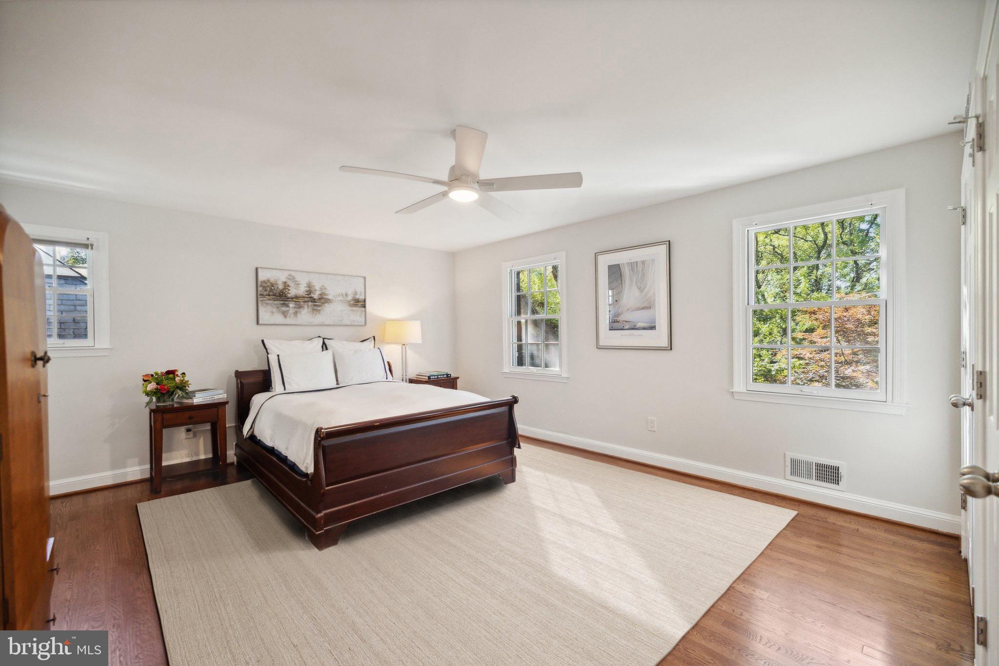 4555 W Street Northwest Washington, DC 20007 - Photo 21 of 34 a spacious bedroom with a bed and a window
