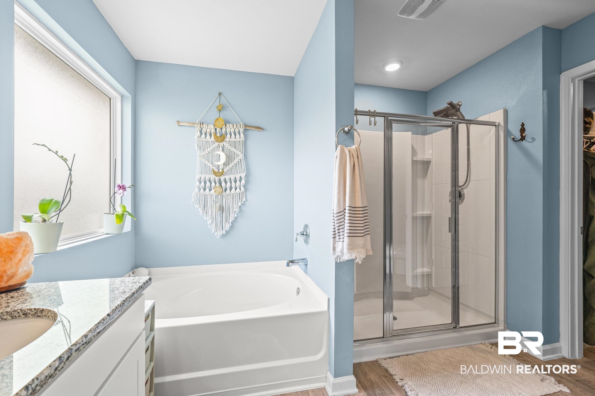 3078 Camino Real Loop Lillian, AL 36549 - Photo 13 of 51 Bathroom with vanity, a stall shower, a bath, and light wood-style flooring