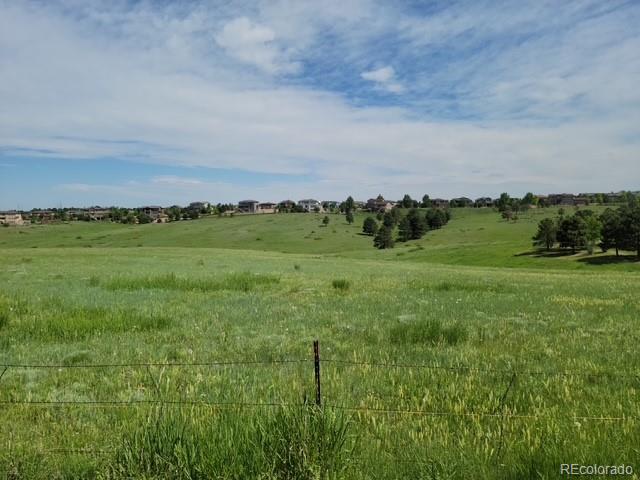 Forest Rim Road Aurora, CO 80016 - Photo 7 of 15 a view of a grassy field with trees