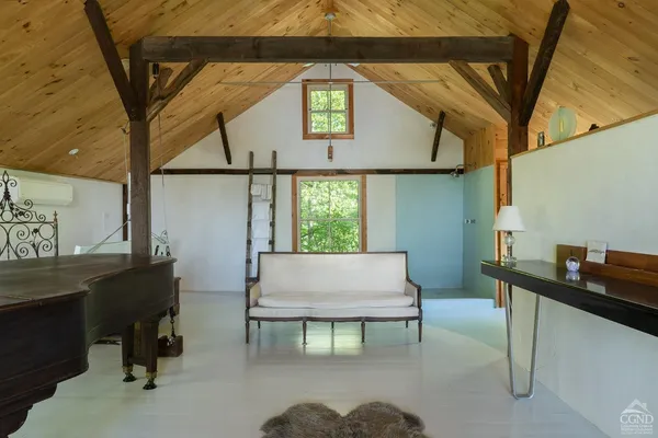 a living room with a table and a window