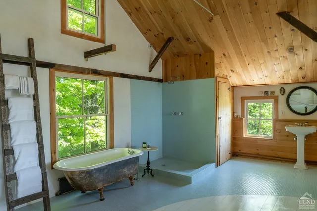 a room with a window and a bed