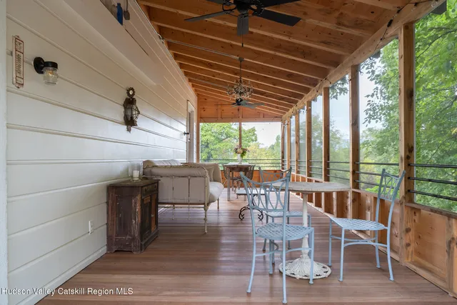a dining room with furniture wooden floor and a rug