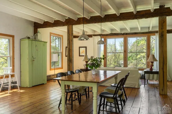 a dining room with furniture and window