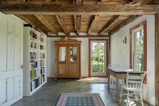 a view of a hallway with entryway door