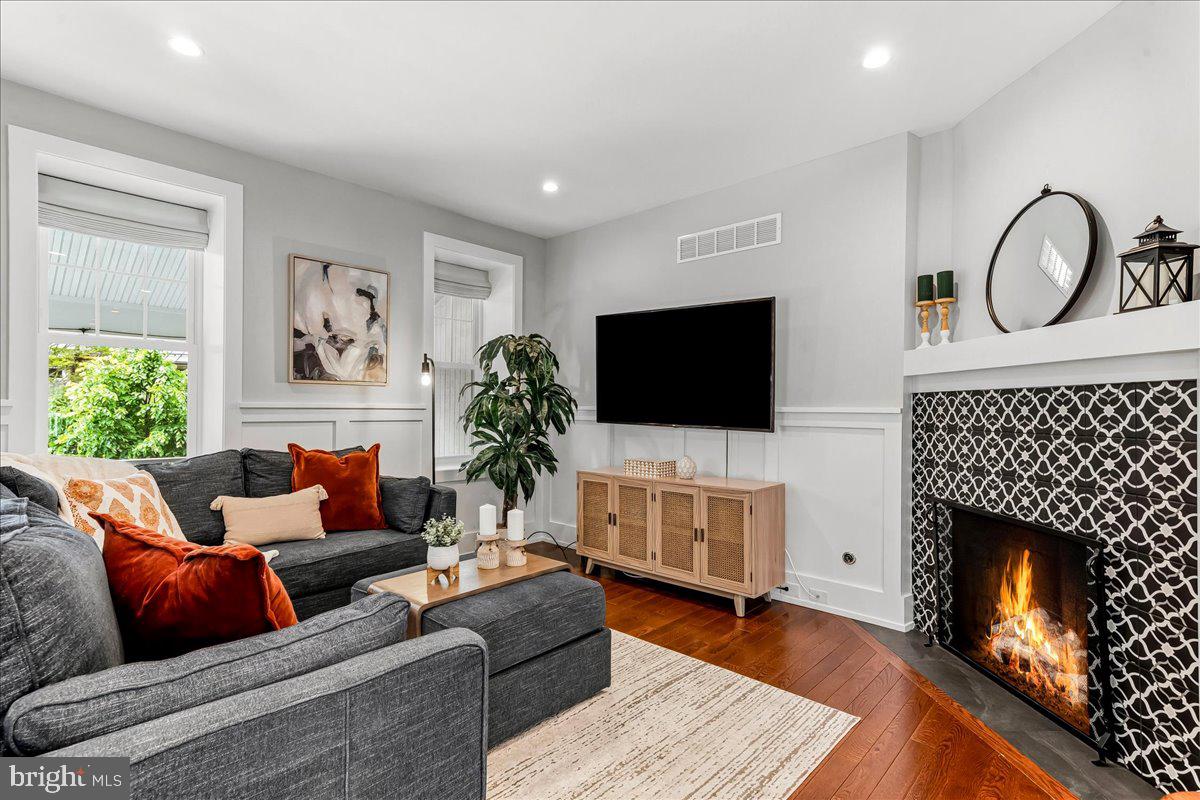 308 Chestnut Avenue Narberth, PA 19072 - Photo 11 of 66 a living room with furniture a flat screen tv and a fireplace