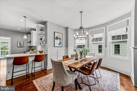 a kitchen with stainless steel appliances a stove a sink and a refrigerator
