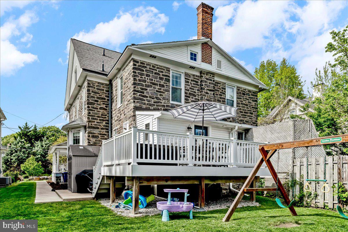308 Chestnut Avenue Narberth, PA 19072 - Photo 27 of 66 a front view of a house with garden and deck