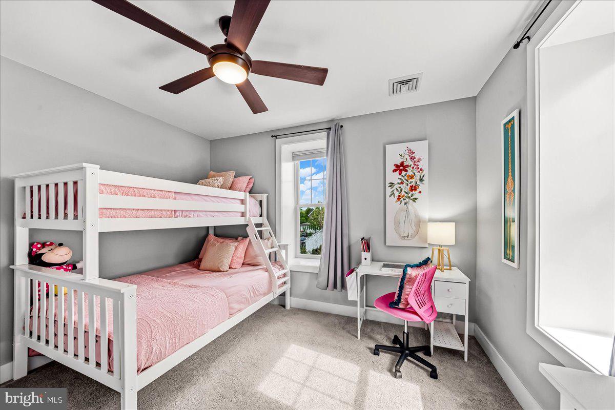 308 Chestnut Avenue Narberth, PA 19072 - Photo 36 of 66 a bedroom with a bed and a chandelier