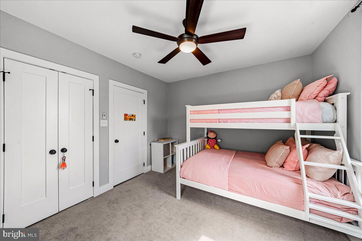 308 Chestnut Avenue Narberth, PA 19072 - Photo 37 of 66 a bedroom with a bed and a chandelier