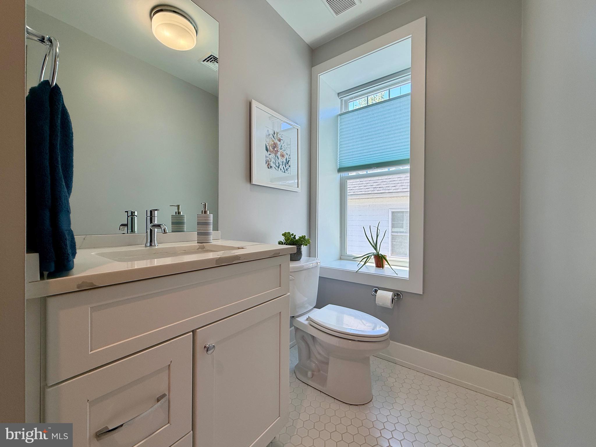 308 Chestnut Avenue Narberth, PA 19072 - Photo 38 of 66 a bathroom with a toilet sink and mirror