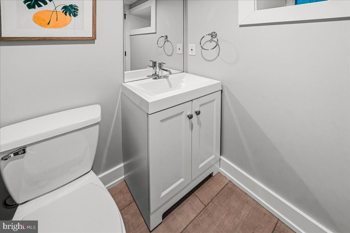 308 Chestnut Avenue Narberth, PA 19072 - Photo 48 of 66 a bathroom with a sink a toilet and vanity