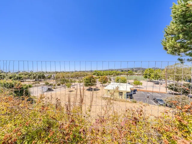 a view of swimming pool and an ocean view