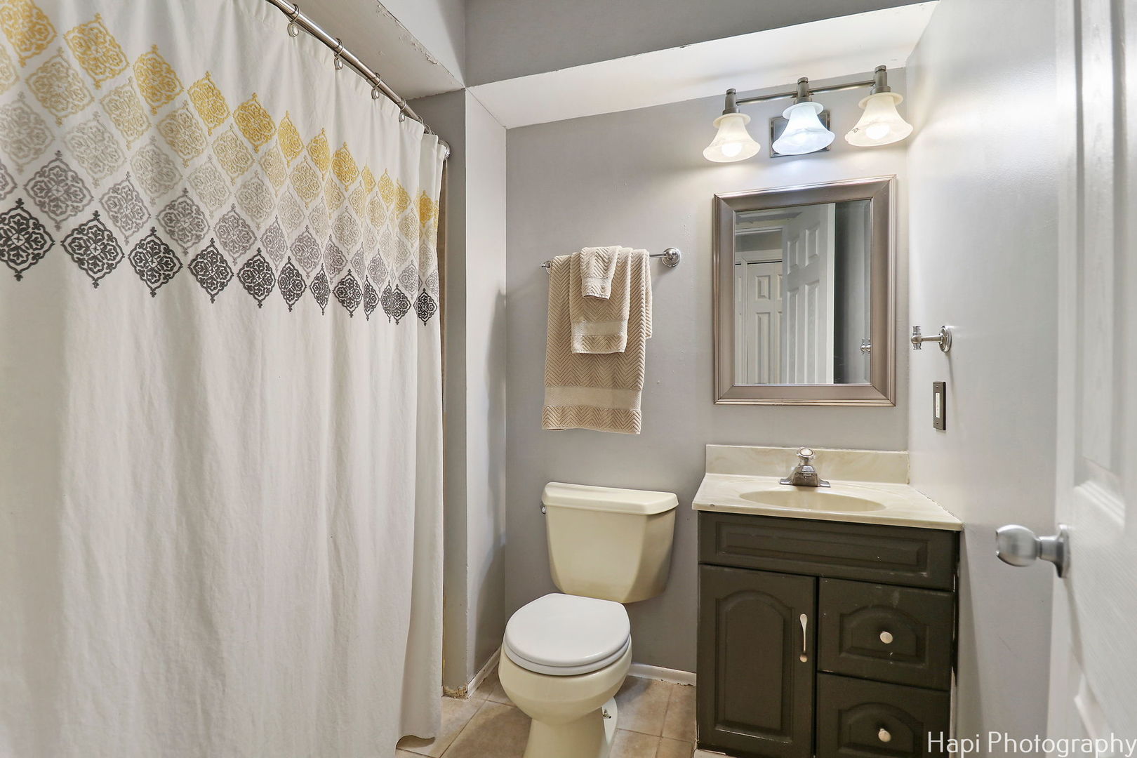 1340 Cary Road Algonquin, IL 60102 - Photo 8 of 21 a bathroom with a toilet sink and mirror