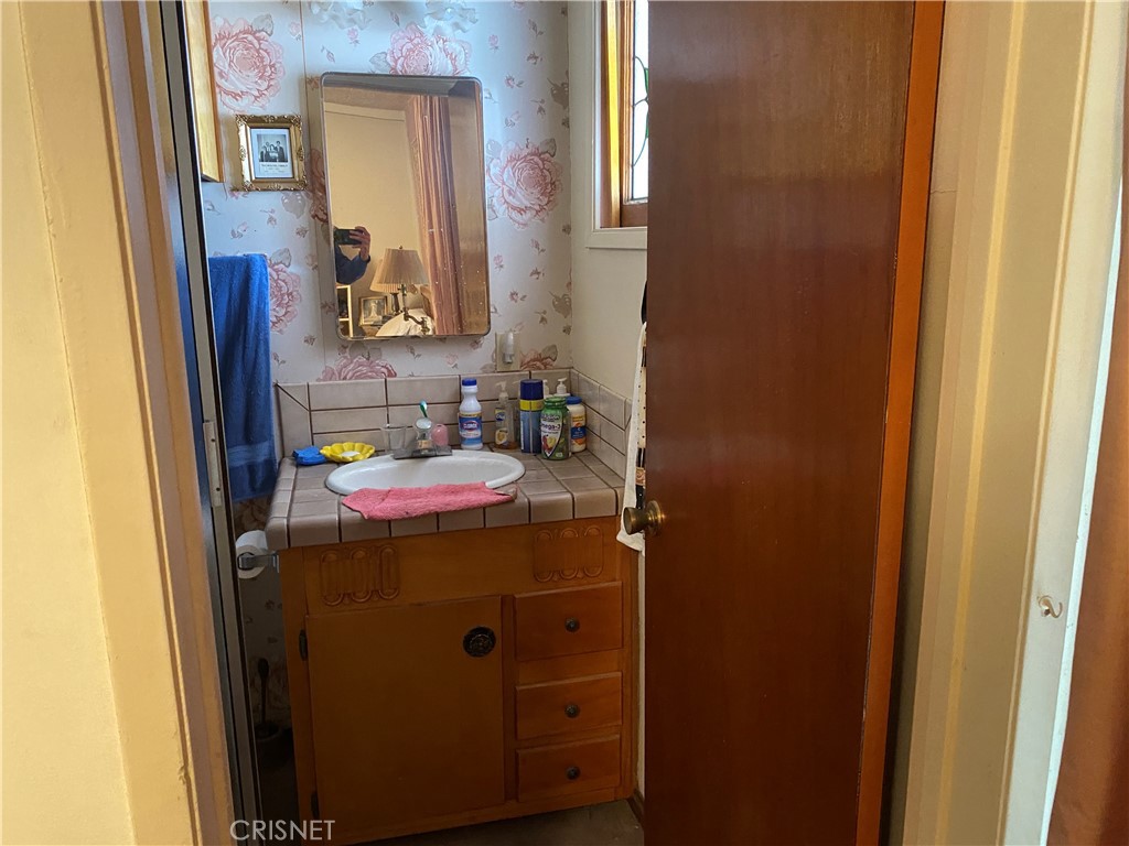 6512 Franrivers Avenue West Hills, CA 91307 - Photo 13 of 24 a bathroom with a sink and a mirror
