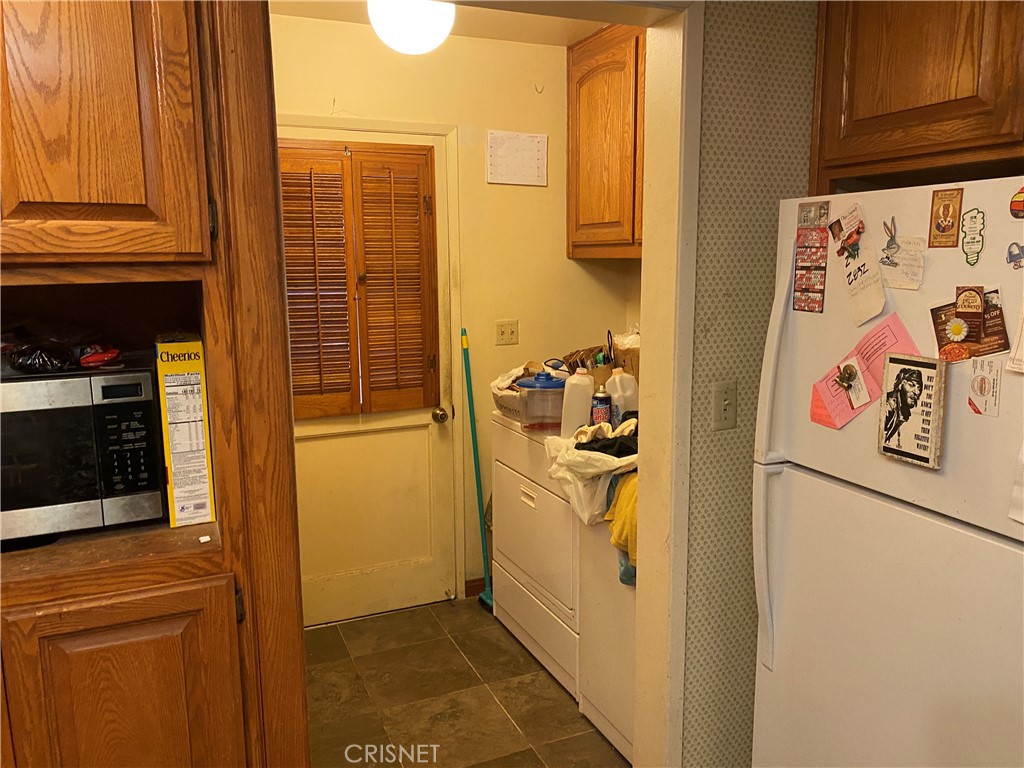 6512 Franrivers Avenue West Hills, CA 91307 - Photo 18 of 24 a bathroom with a refrigerator and cabinets