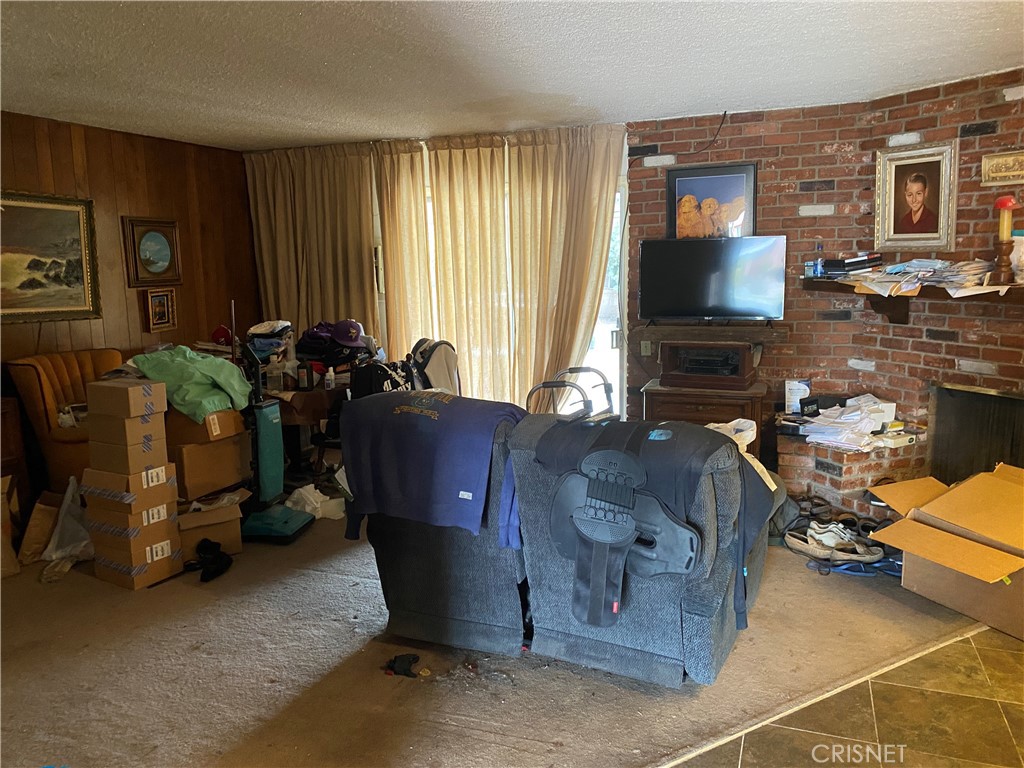6512 Franrivers Avenue West Hills, CA 91307 - Photo 21 of 24 a living room with furniture and a flat screen tv