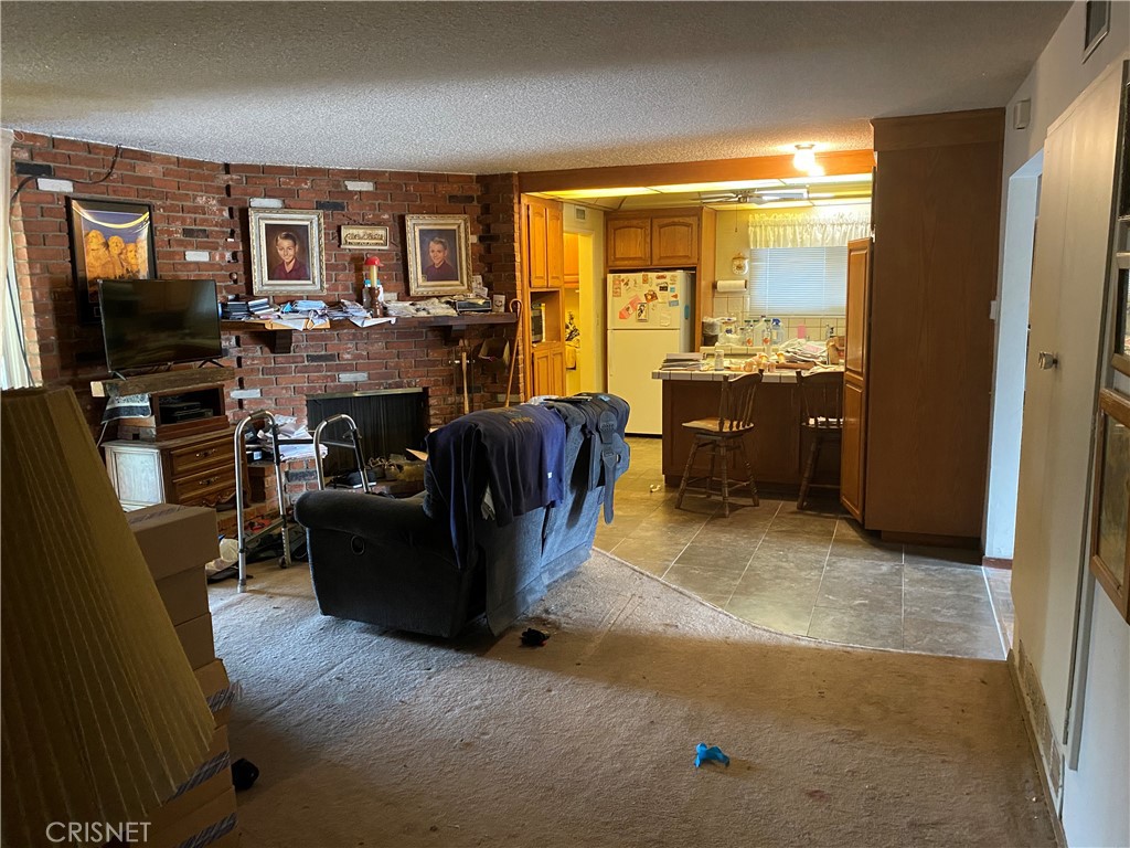 6512 Franrivers Avenue West Hills, CA 91307 - Photo 22 of 24 a living room with furniture and a flat screen tv
