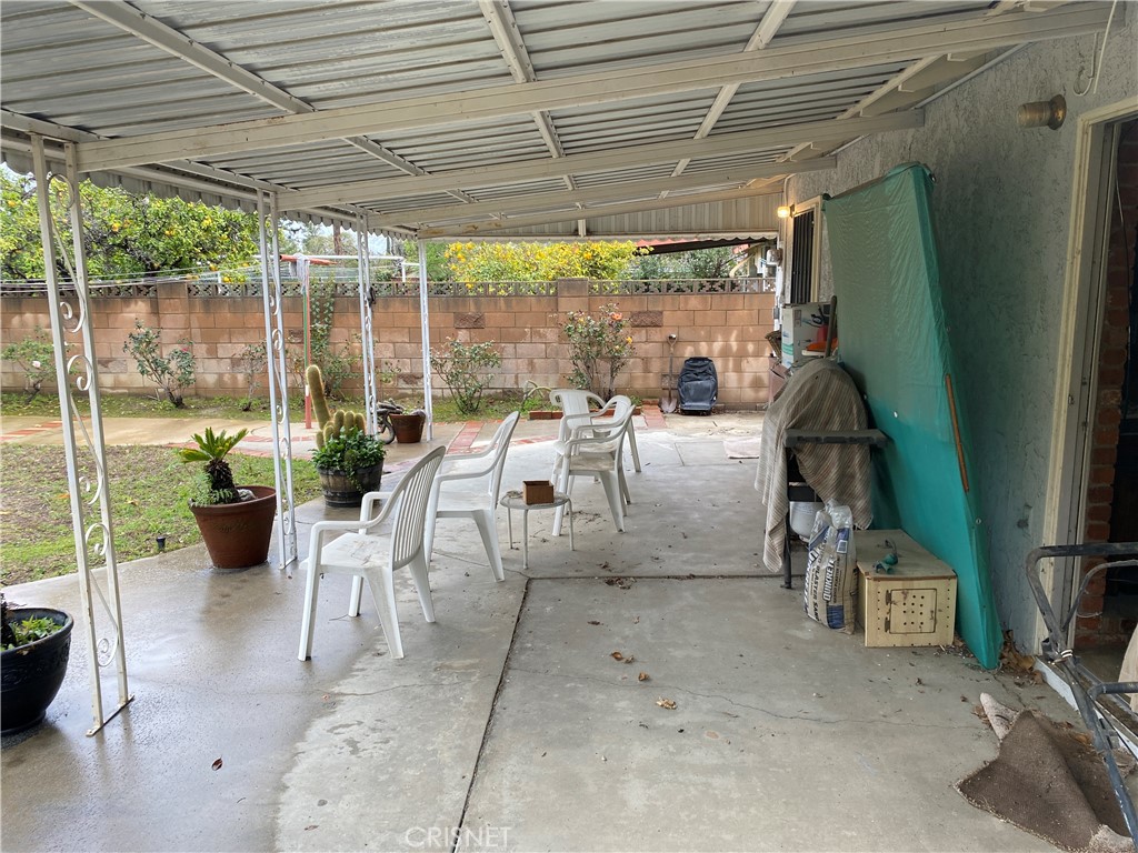 6512 Franrivers Avenue West Hills, CA 91307 - Photo 5 of 24 a building outdoor space with patio furniture and potted plants