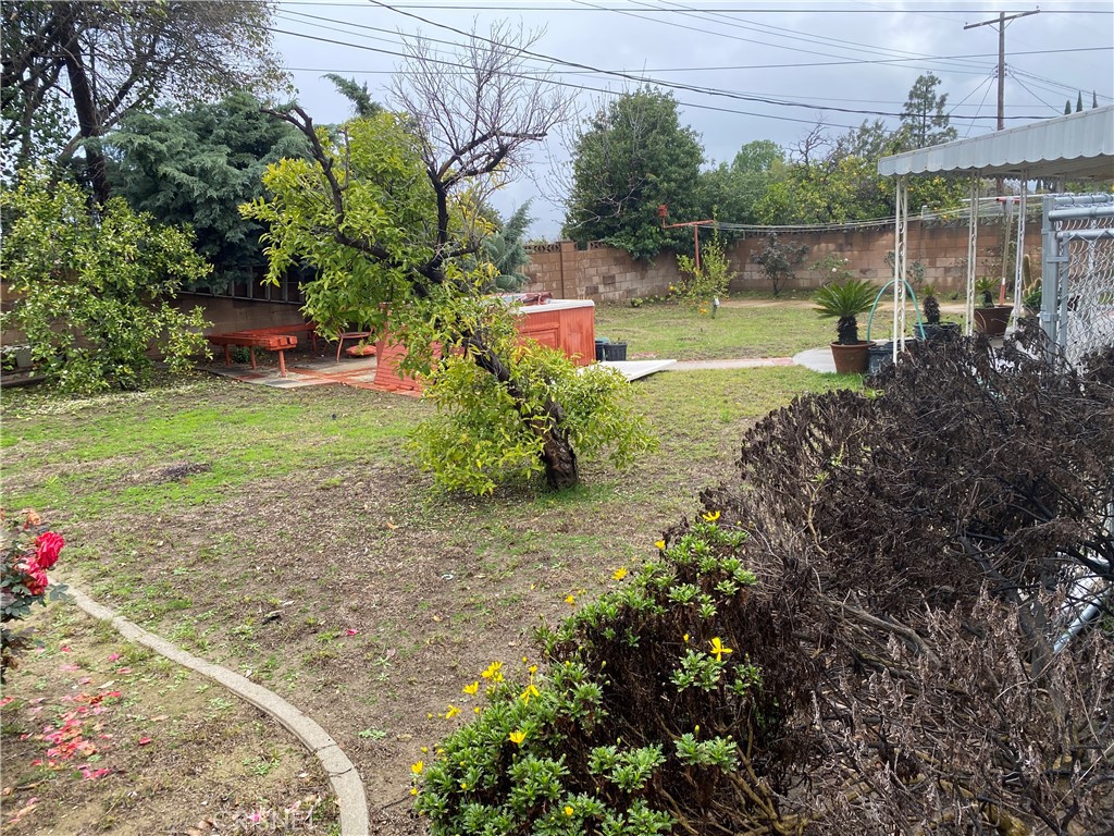 6512 Franrivers Avenue West Hills, CA 91307 - Photo 7 of 24 a backyard of a house with a yard and outdoor seating