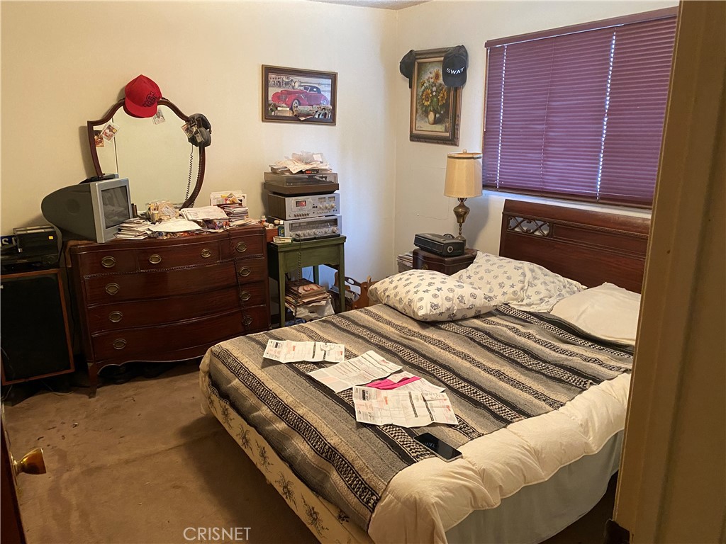 6512 Franrivers Avenue West Hills, CA 91307 - Photo 9 of 24 a bedroom with a bed and dresser