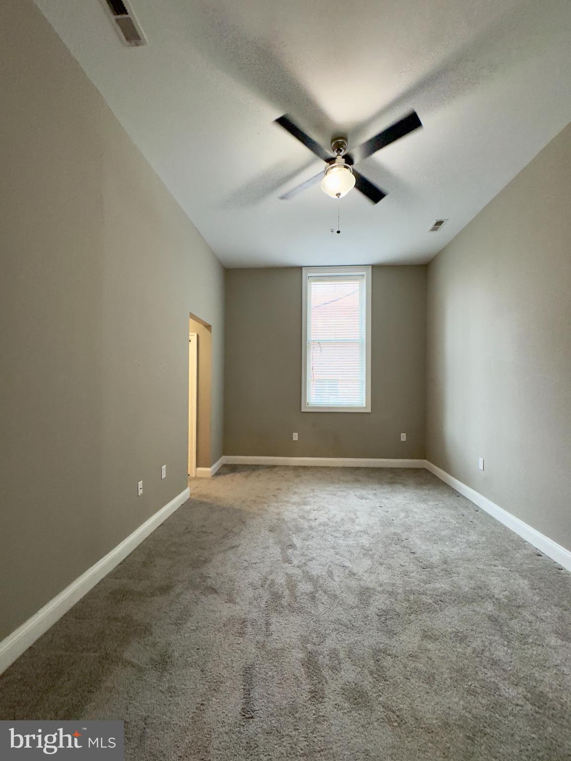 803 Cathedral Street, Unit 4 Baltimore, MD 21201 - Photo 5 of 12 a view of an empty room with a window