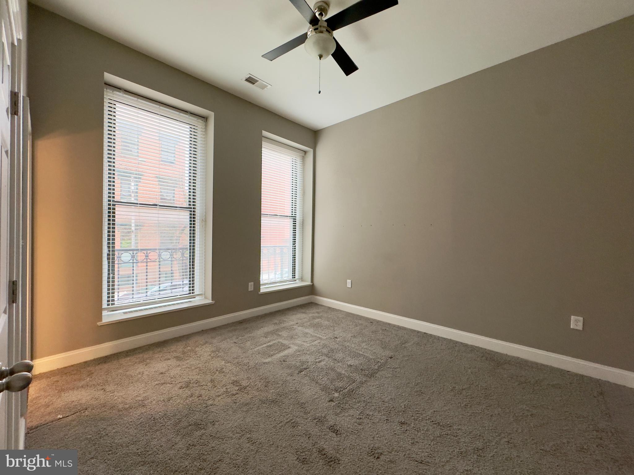 803 Cathedral Street, Unit 4 Baltimore, MD 21201 - Photo 10 of 12 a view of an empty room with a window