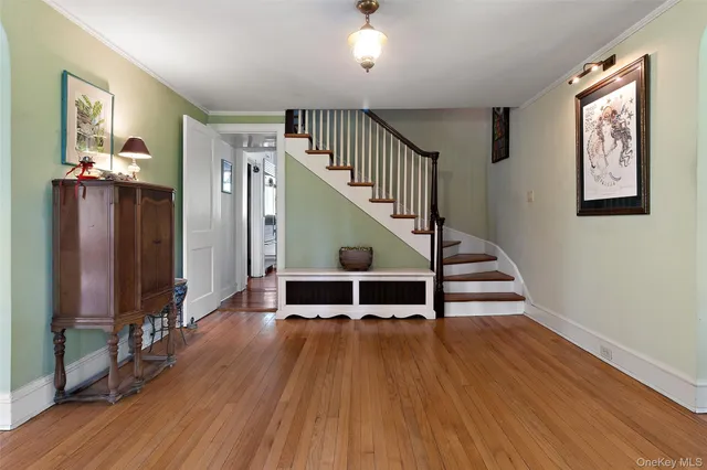 a spacious bedroom with a bed a mirror and desk
