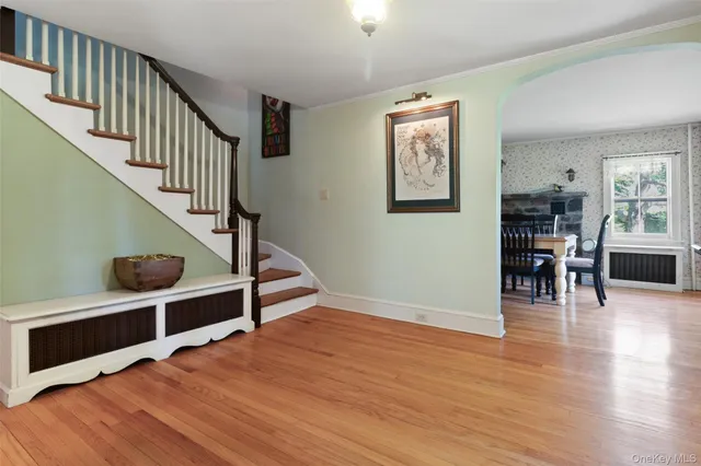 a room with furniture a rug and a window