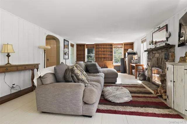 a bathroom with a toilet a sink and a window